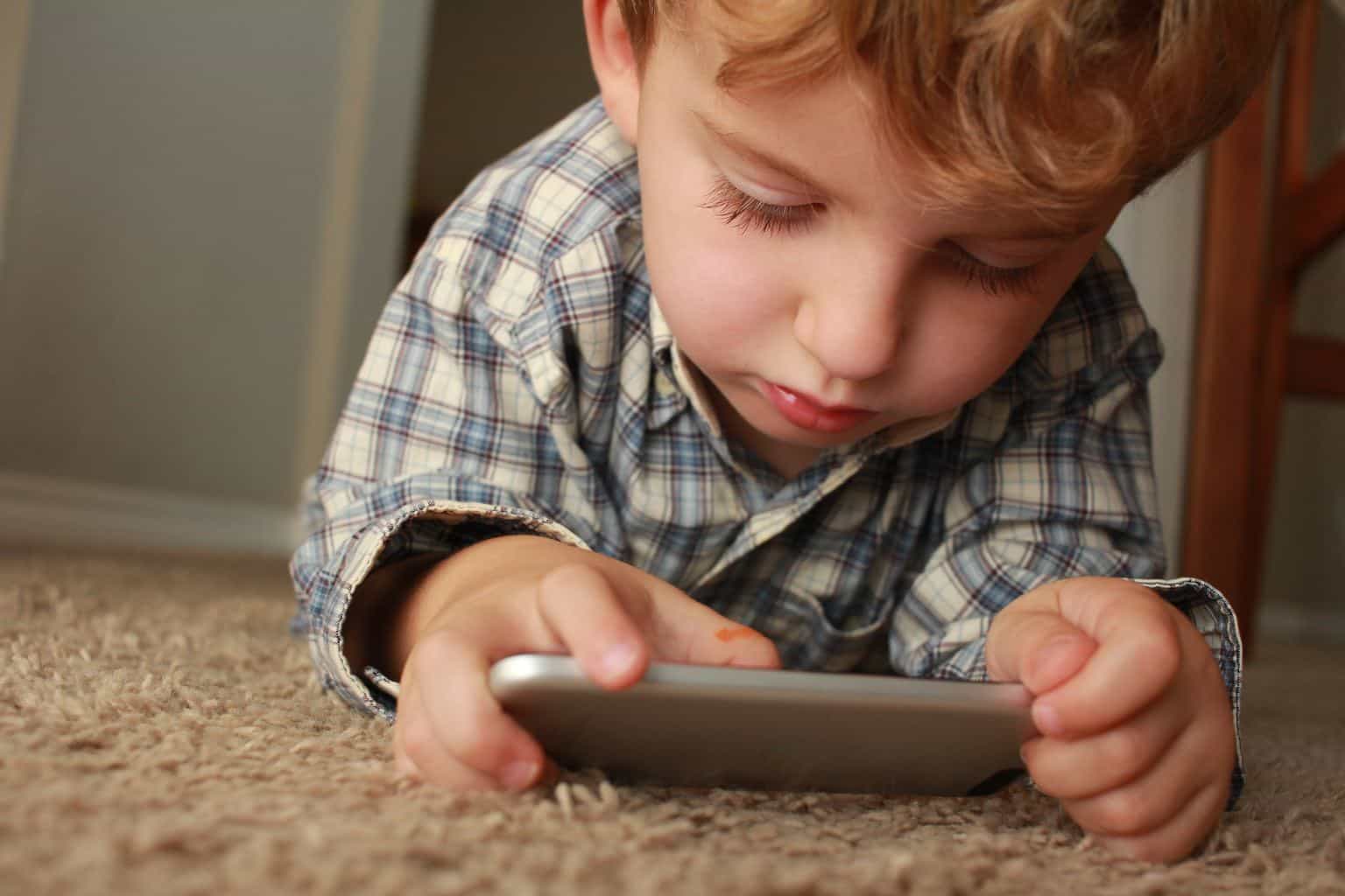 Child playing with an iPhone