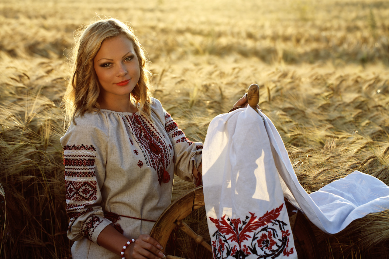 a beautiful young Ukrainian girl in traditional dress with embroidered