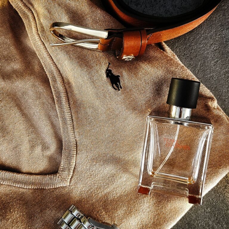Outfit personality - men's accessories flatlay with belt, watch and fragrance