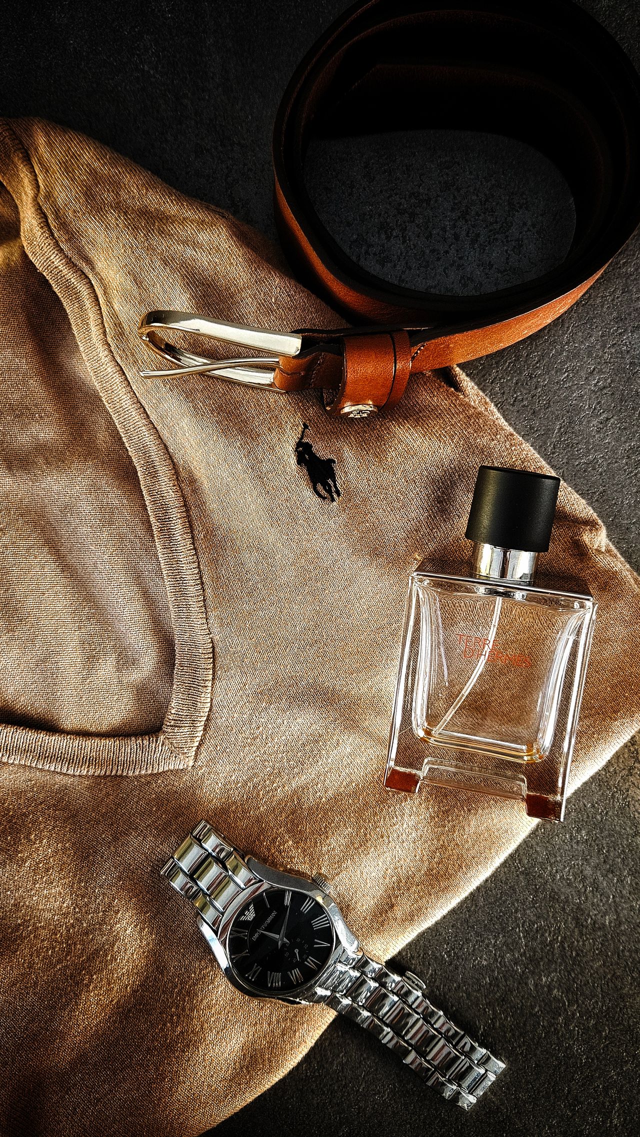 Outfit personality - men's accessories flatlay with belt, watch and fragrance